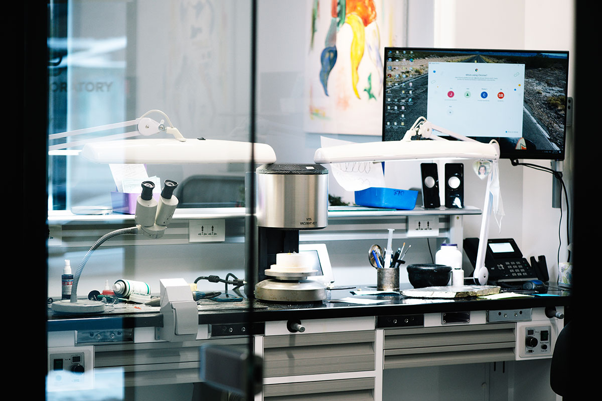 the workbench at SB Dental Laboratories displaying the tools, machinery and equipment required to create dental ceramics